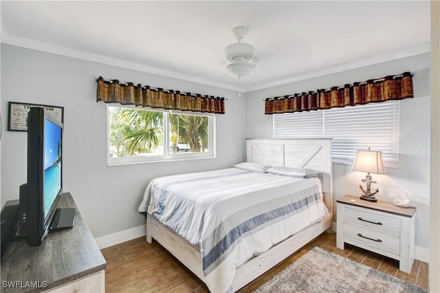 bedroom with ornamental molding and ceiling fan