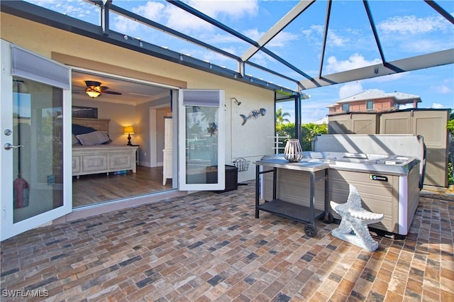 view of patio with glass enclosure