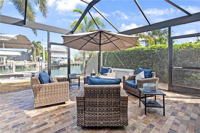 view of patio with a water view, an outdoor hangout area, and a boat dock