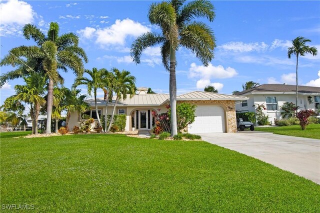 ranch-style house with a garage and a front lawn