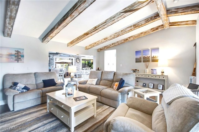 living room with lofted ceiling with beams