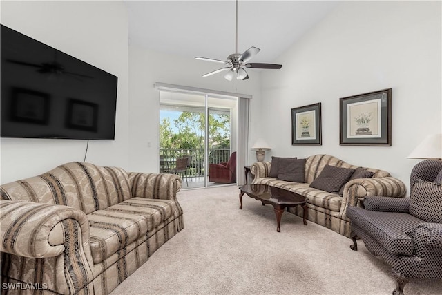 carpeted living room featuring high vaulted ceiling and ceiling fan