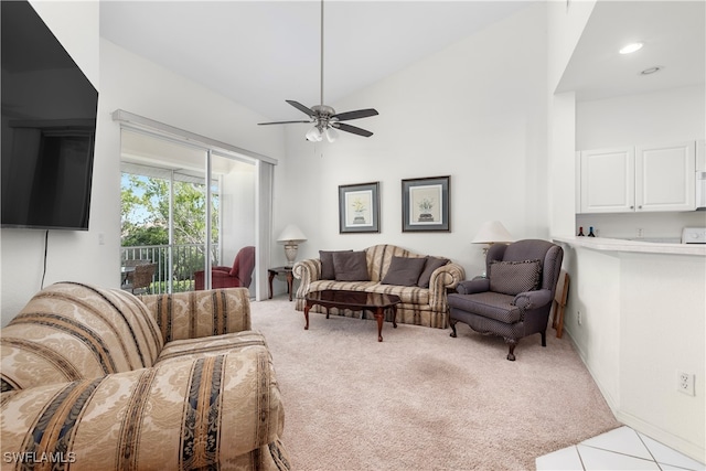 living room with light carpet, ceiling fan, and lofted ceiling