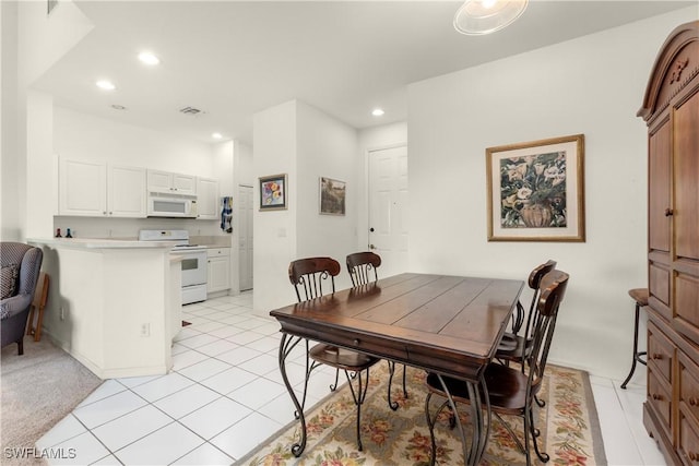 dining room with light tile patterned flooring