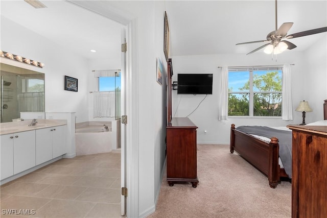 bedroom featuring multiple windows and light colored carpet