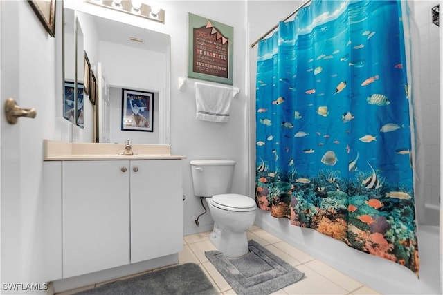 full bathroom with vanity, toilet, tile patterned floors, and shower / bath combo with shower curtain