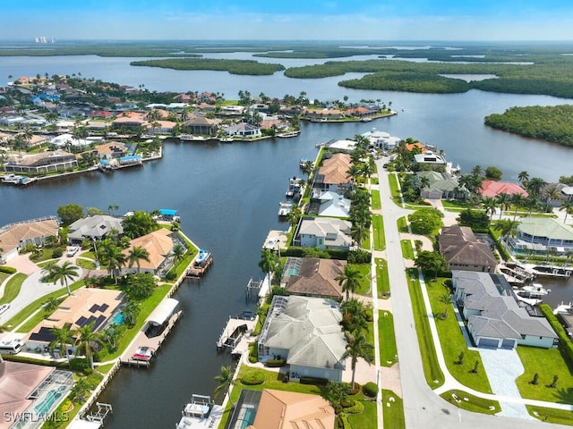 bird's eye view with a residential view and a water view