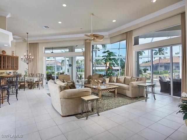 tiled living room featuring ceiling fan with notable chandelier and crown molding