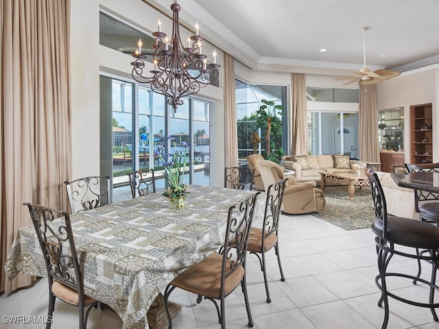 dining area featuring light tile patterned floors, ornamental molding, and a ceiling fan