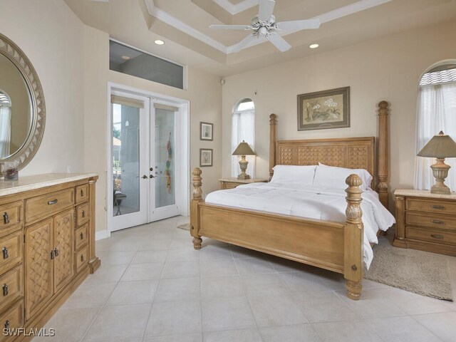 bedroom with a raised ceiling, french doors, access to outside, light tile patterned flooring, and ceiling fan