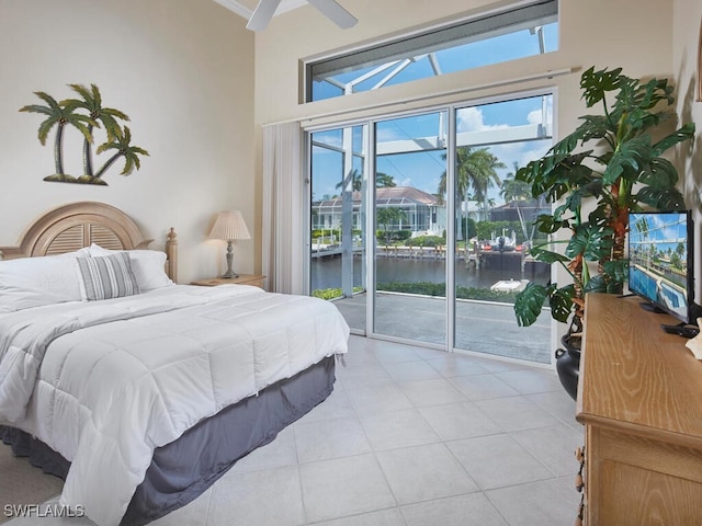 bedroom with access to exterior and light tile patterned floors