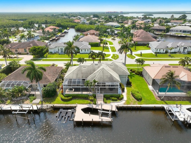 aerial view with a water view and a residential view