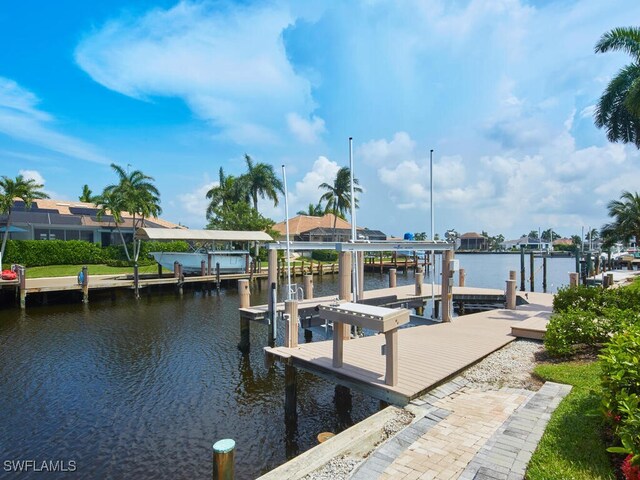 view of dock featuring a water view and boat lift