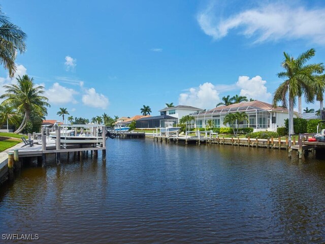 dock area with a water view and boat lift