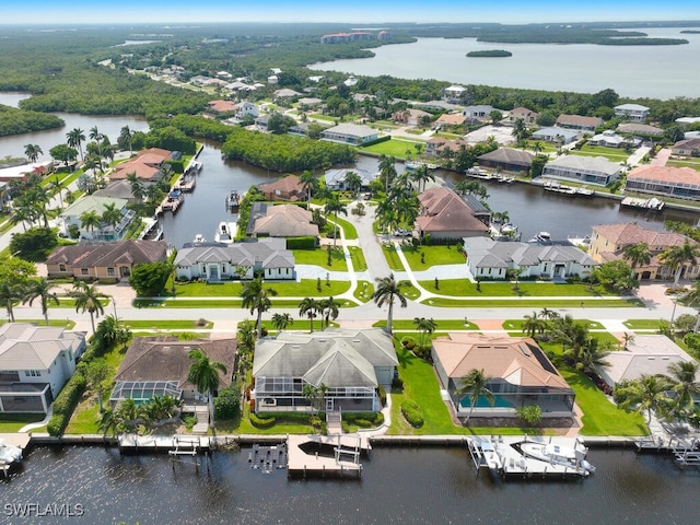 bird's eye view featuring a residential view and a water view