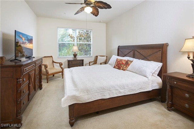 bedroom featuring ceiling fan and light colored carpet