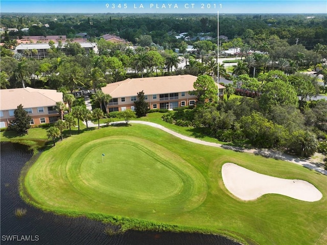 bird's eye view with view of golf course and a water view