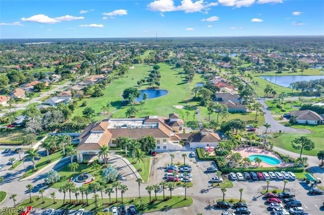 drone / aerial view featuring a water view and a residential view