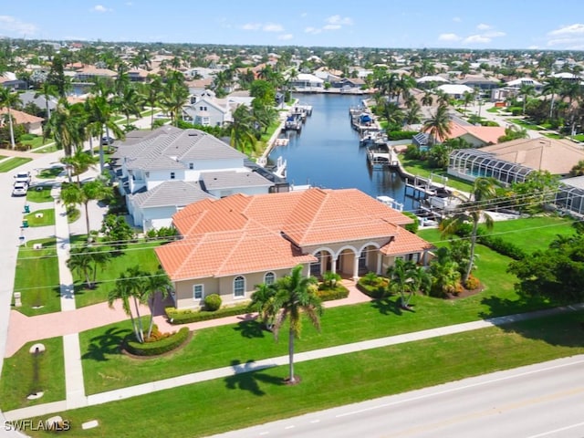 birds eye view of property with a water view