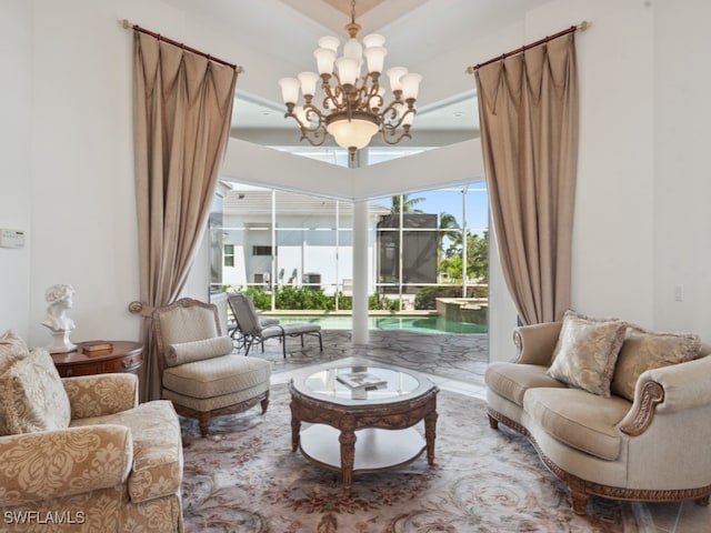 living room with an inviting chandelier