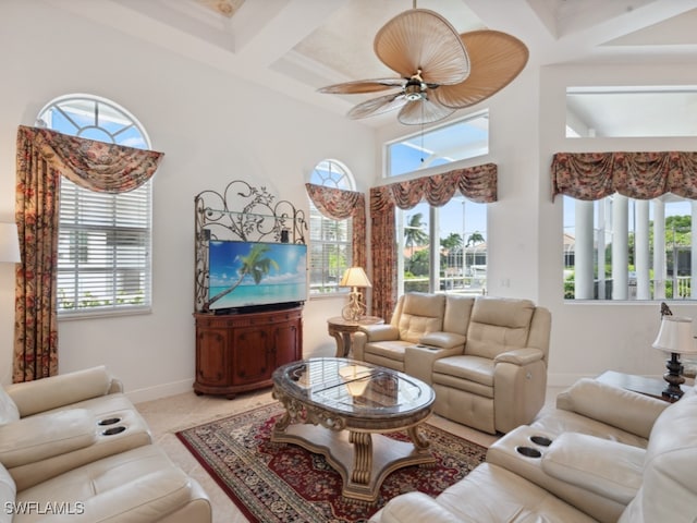 living room with light tile patterned flooring, coffered ceiling, and ceiling fan