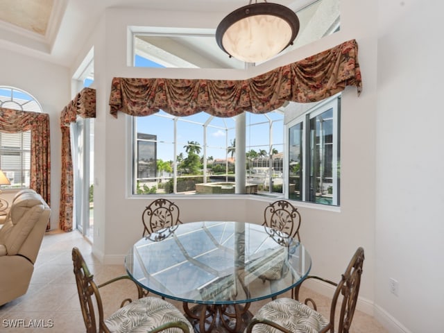 dining space with light tile patterned floors and a wealth of natural light