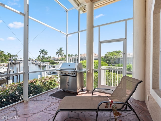 sunroom with a water view