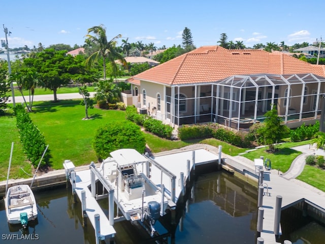 dock area with a lawn and a lanai