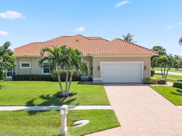 mediterranean / spanish house featuring a front lawn and a garage