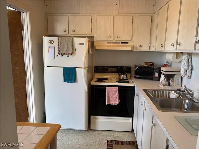 kitchen with sink, white appliances, custom exhaust hood, and light brown cabinets