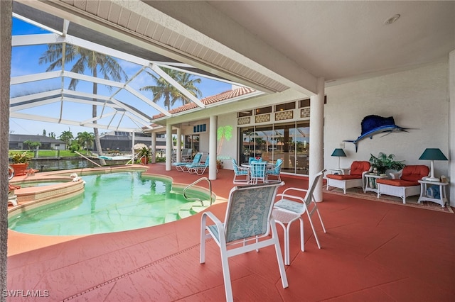 view of swimming pool featuring an in ground hot tub, a water view, glass enclosure, and a patio area