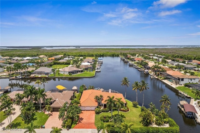 bird's eye view with a residential view and a water view