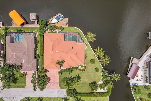 birds eye view of property with a water view