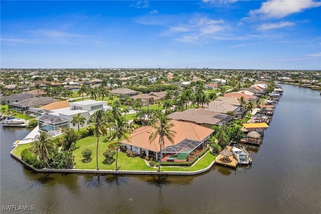 aerial view featuring a residential view and a water view