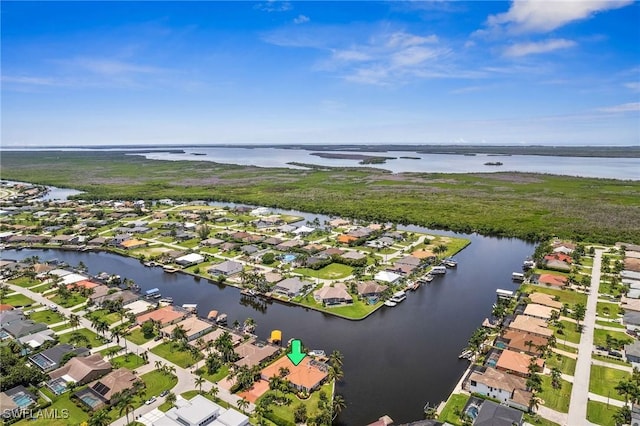 bird's eye view featuring a residential view and a water view