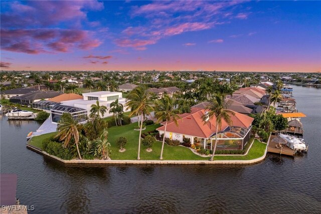 aerial view at dusk with a water view