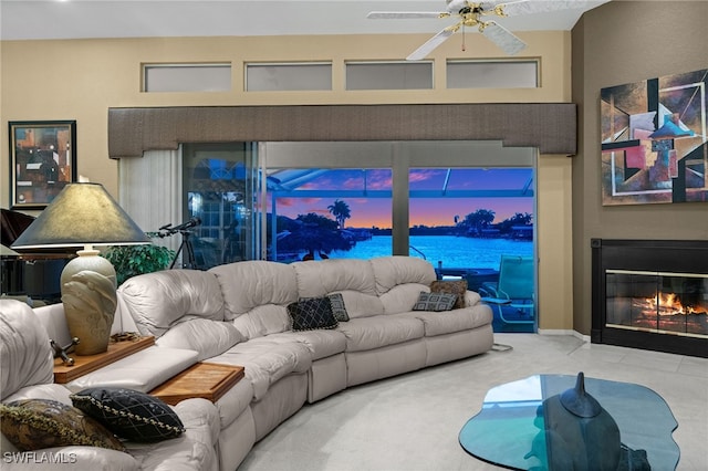 carpeted living room featuring ceiling fan