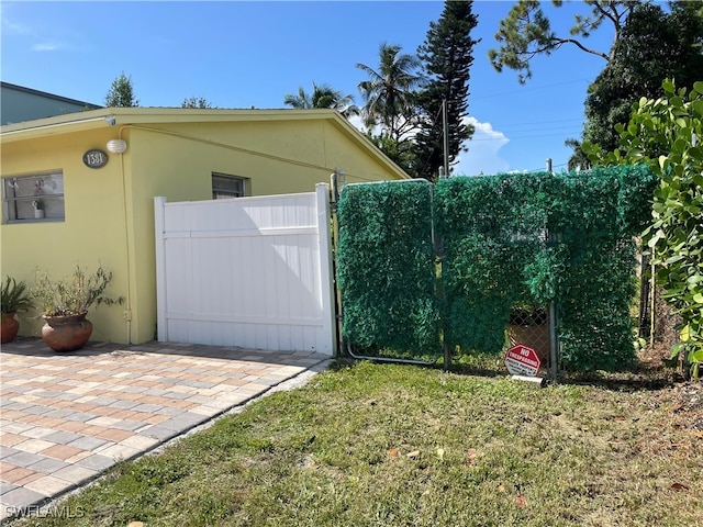 view of property exterior featuring a lawn