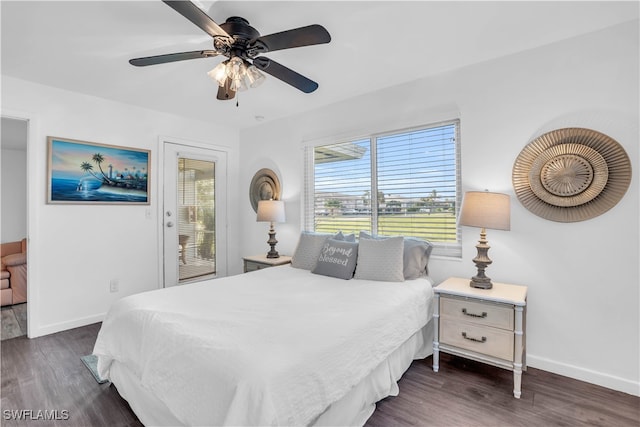 bedroom featuring access to exterior, dark hardwood / wood-style floors, and ceiling fan