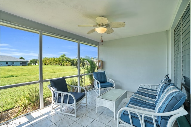 sunroom featuring ceiling fan