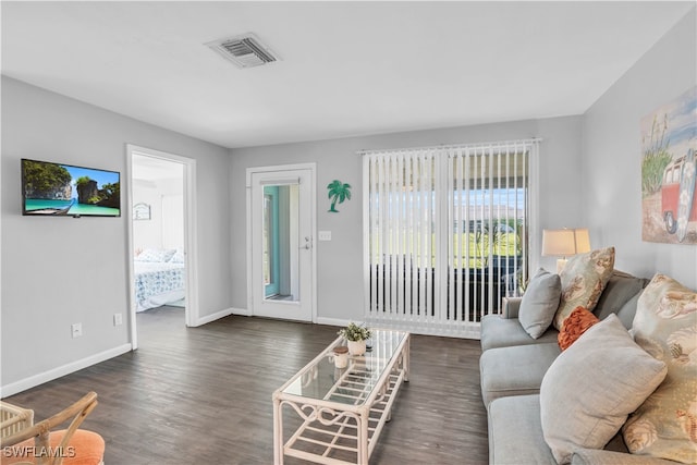 living room with dark hardwood / wood-style floors