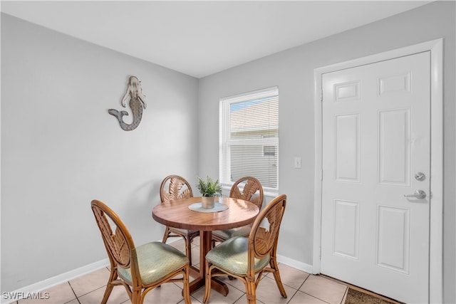 dining room with light tile patterned flooring