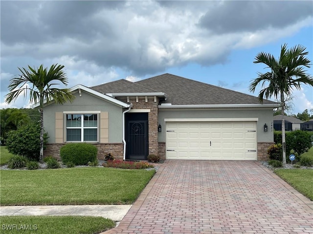 view of front facade featuring a garage and a front lawn