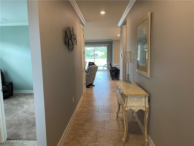 hall featuring crown molding and carpet