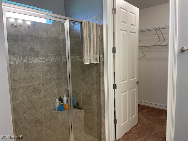 bathroom with a shower with shower door