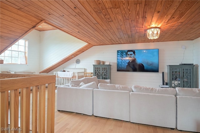 living room with light hardwood / wood-style flooring, vaulted ceiling, and wooden ceiling