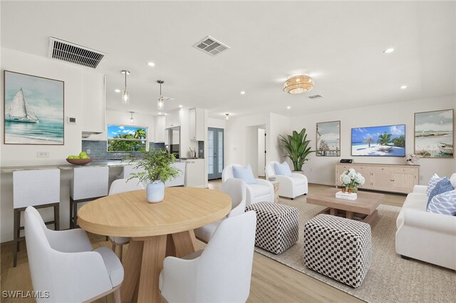 dining space featuring light hardwood / wood-style floors