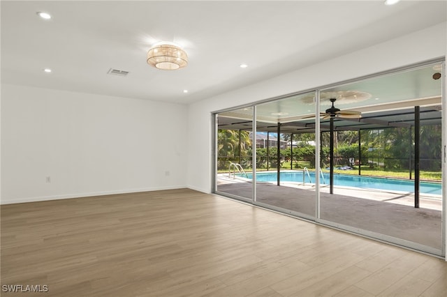 empty room featuring light hardwood / wood-style flooring and ceiling fan