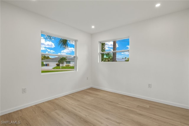 empty room with light hardwood / wood-style floors