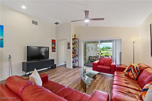 living room featuring vaulted ceiling, ceiling fan, and light hardwood / wood-style floors